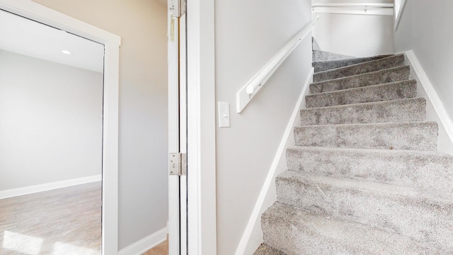 stairs featuring baseboards