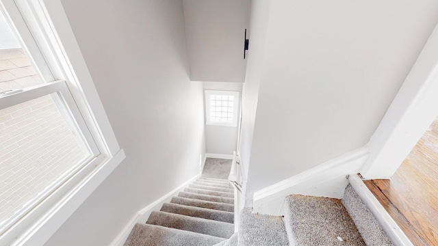 stairway featuring baseboards