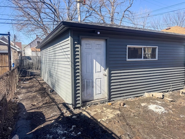 view of outdoor structure featuring fence