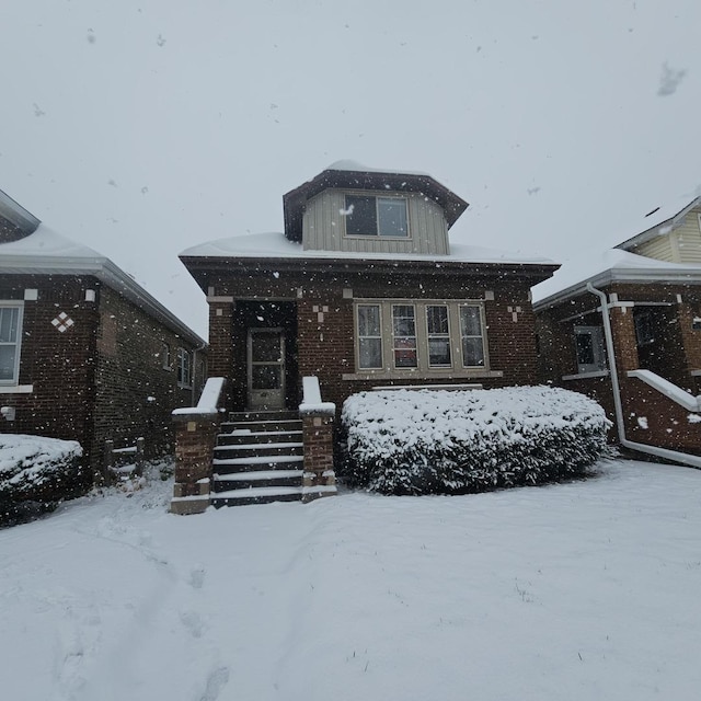 view of front of home featuring brick siding