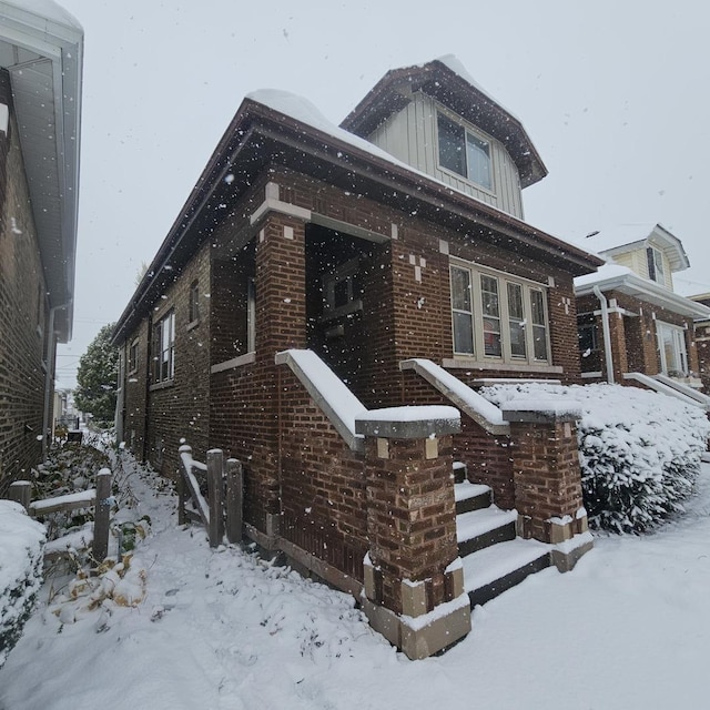 view of front of house with brick siding