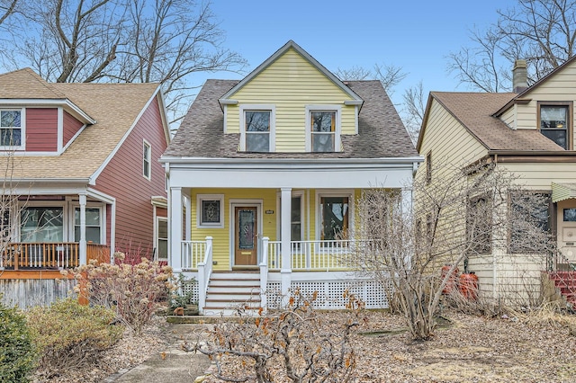 view of front of property featuring covered porch and roof with shingles