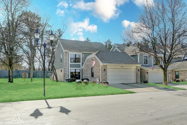 view of front of property with brick siding, roof with shingles, concrete driveway, fence, and a front lawn