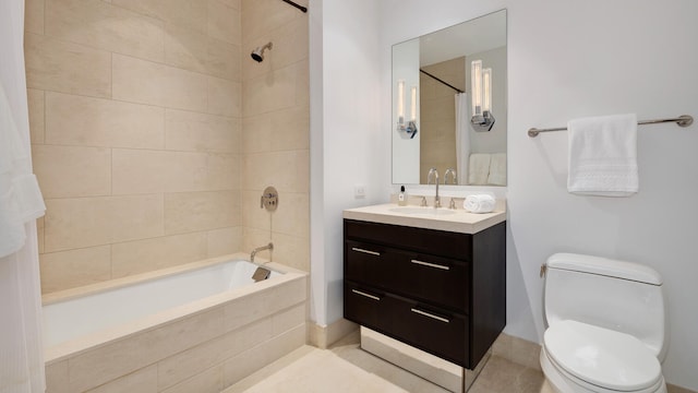 bathroom featuring toilet, shower / bathing tub combination, and vanity