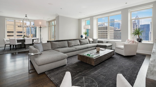 living room featuring a view of city, a chandelier, dark wood finished floors, and crown molding