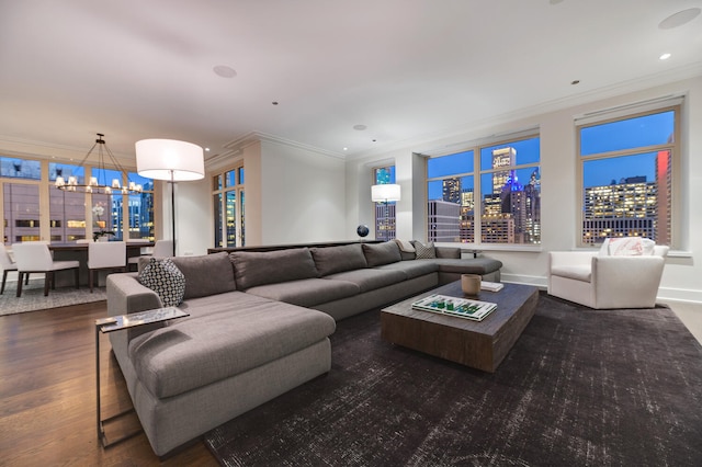 living area with a view of city, ornamental molding, a chandelier, and dark wood-style flooring