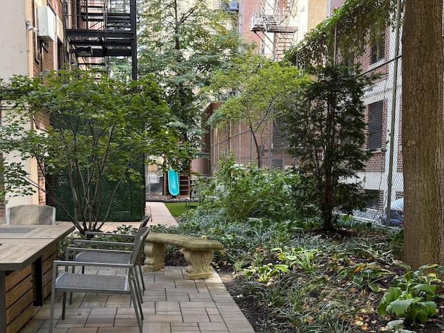 exterior space with stairway and outdoor dining space