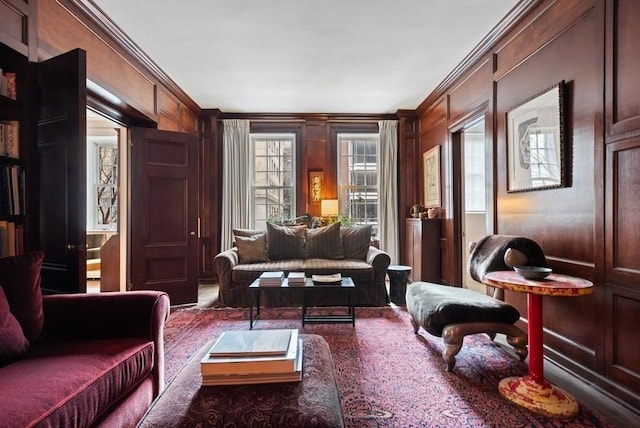 living area featuring ornamental molding