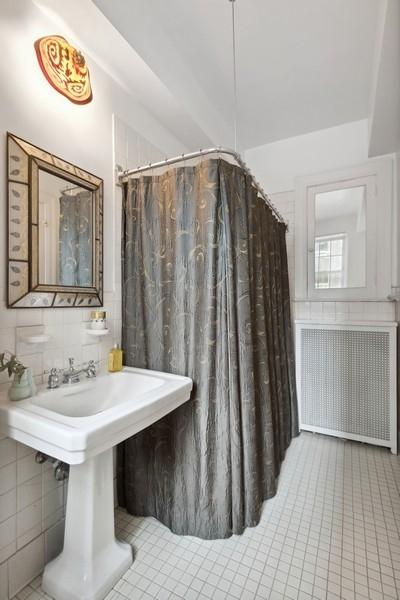 full bath with tile patterned flooring and tile walls