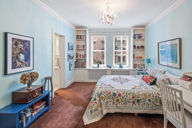 bedroom featuring crown molding, ensuite bathroom, and an inviting chandelier