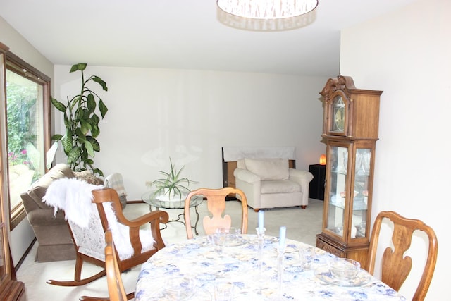 dining space featuring light colored carpet