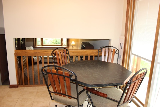 dining space with light tile patterned floors