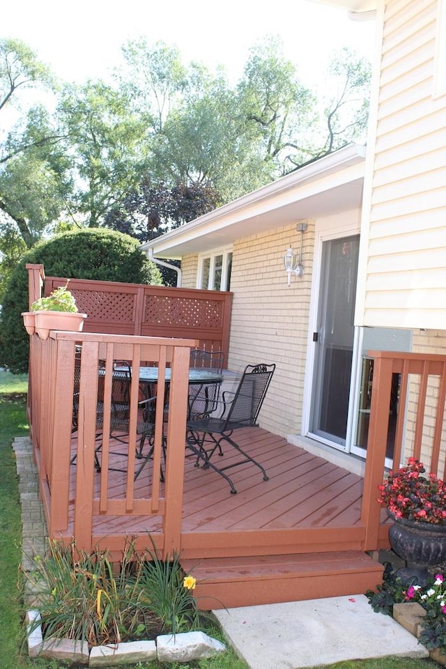 wooden deck with outdoor dining area