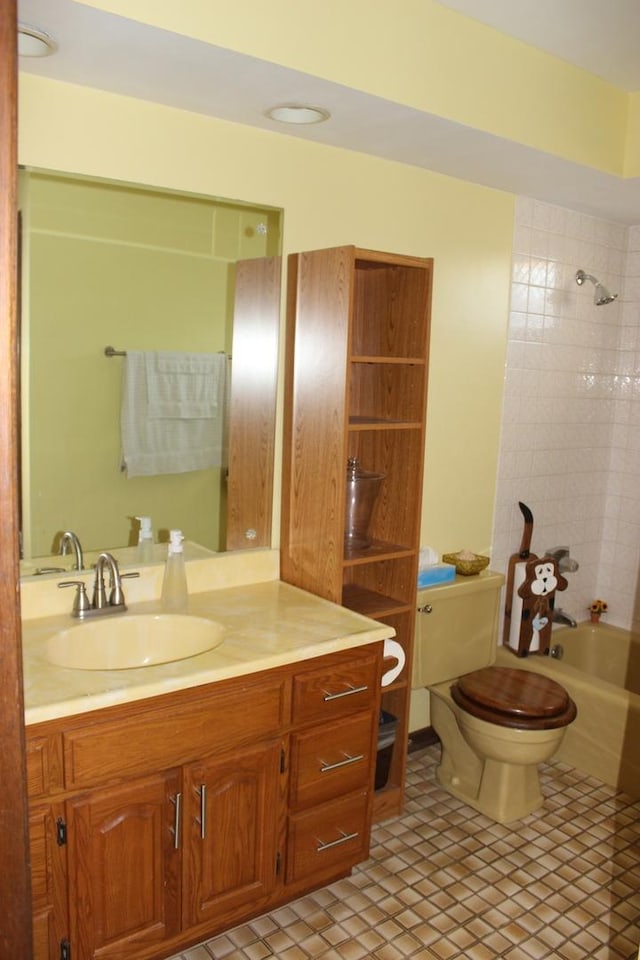 bathroom with toilet, bathtub / shower combination, and vanity