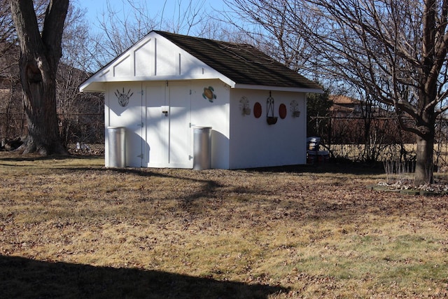 view of shed with fence