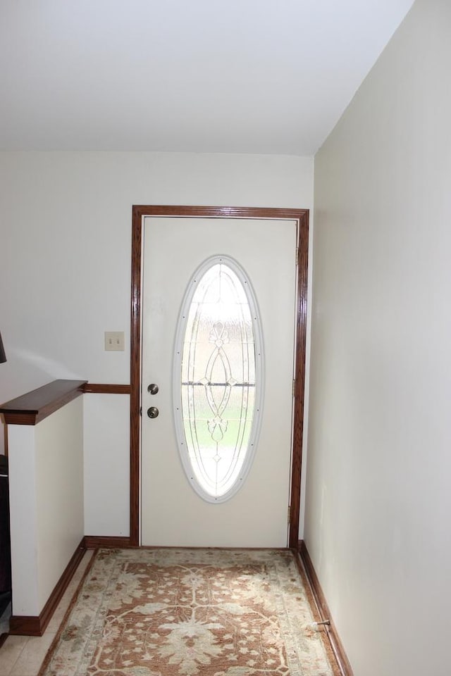 entryway featuring baseboards