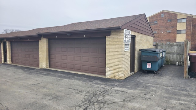 garage featuring fence