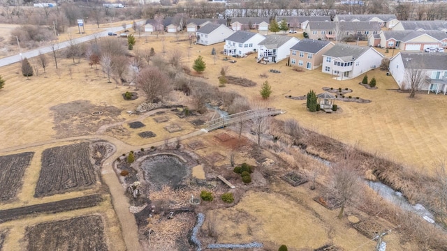 birds eye view of property with a residential view