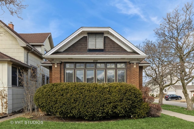 view of front of house with brick siding