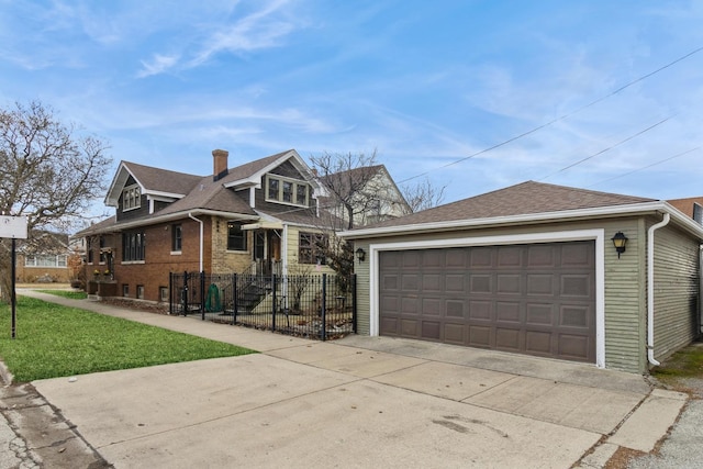 view of front of house featuring a shingled roof, fence, an outdoor structure, a front yard, and brick siding