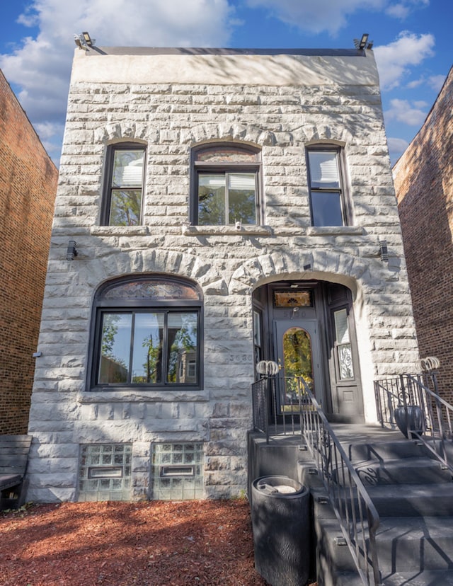 view of front of house with stone siding