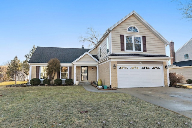 traditional home with brick siding, a shingled roof, a front yard, a garage, and driveway