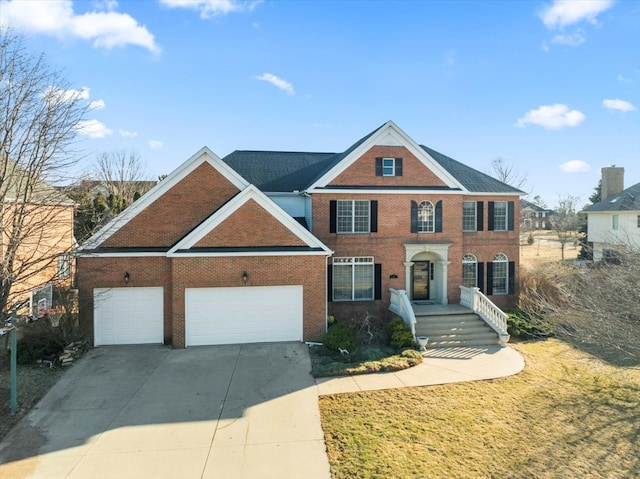 view of front of home featuring a garage, concrete driveway, brick siding, and a front yard