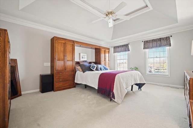 bedroom featuring a tray ceiling and ornamental molding