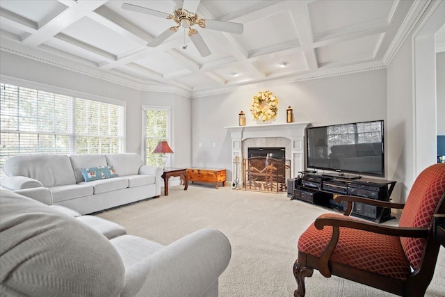 carpeted living room with coffered ceiling, a tile fireplace, beam ceiling, and a ceiling fan