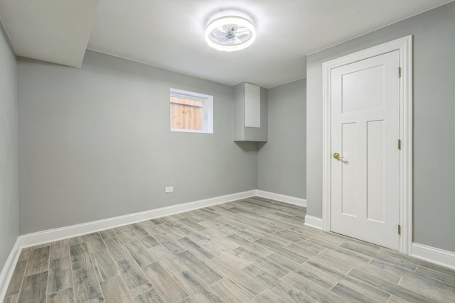 interior space with light wood finished floors and baseboards