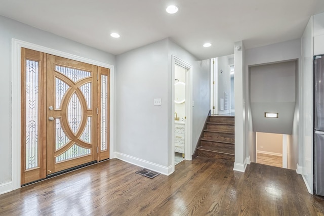 entrance foyer with baseboards, visible vents, stairway, dark wood-type flooring, and recessed lighting