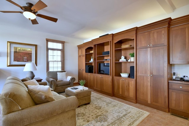 living room featuring visible vents, a ceiling fan, and light tile patterned flooring