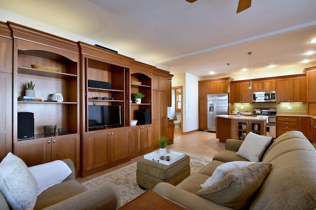 living room with light tile patterned floors, baseboards, a ceiling fan, and recessed lighting