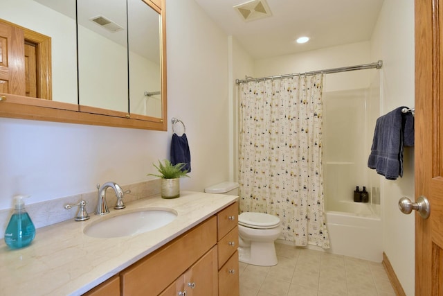 bathroom with tile patterned flooring, visible vents, vanity, and toilet