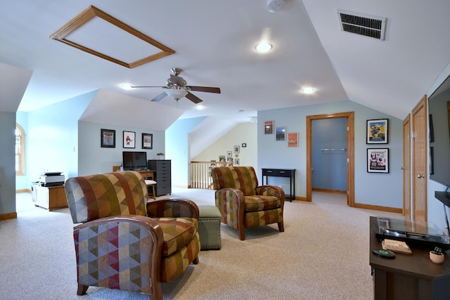 living room with visible vents, vaulted ceiling, light carpet, and baseboards