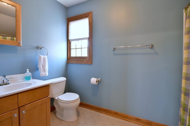 bathroom with toilet, tile patterned floors, vanity, baseboards, and a shower with curtain