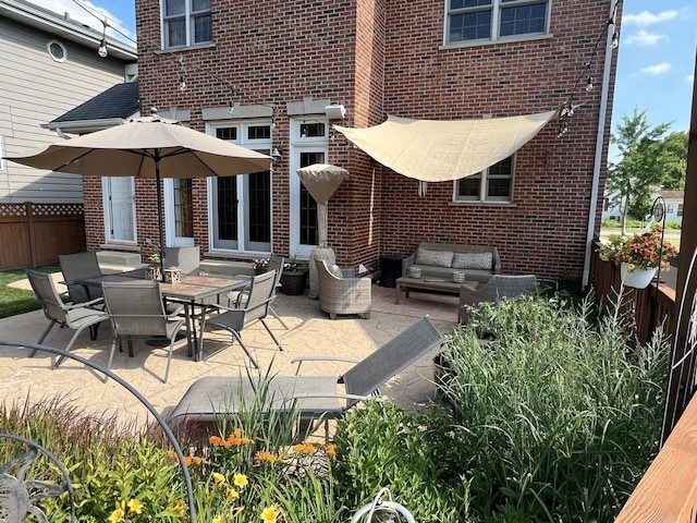 view of patio / terrace featuring entry steps and fence