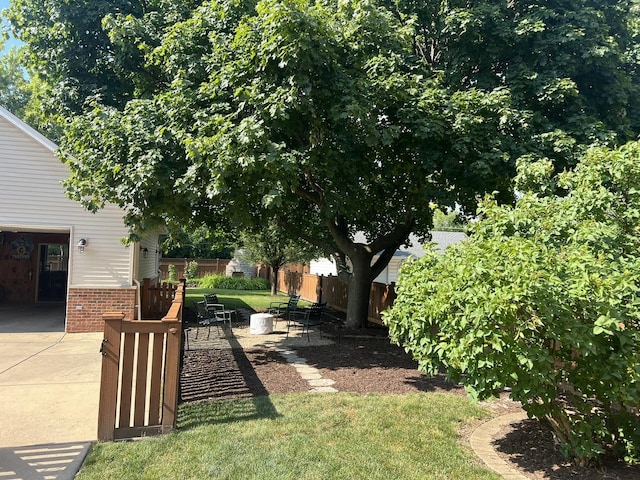 view of yard featuring a patio area and fence