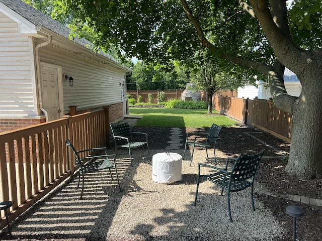 view of yard with a patio area and a fenced backyard