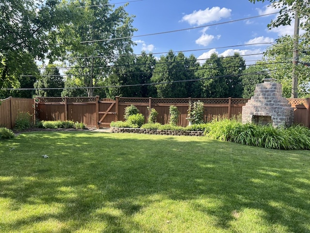 view of yard featuring a gate and fence