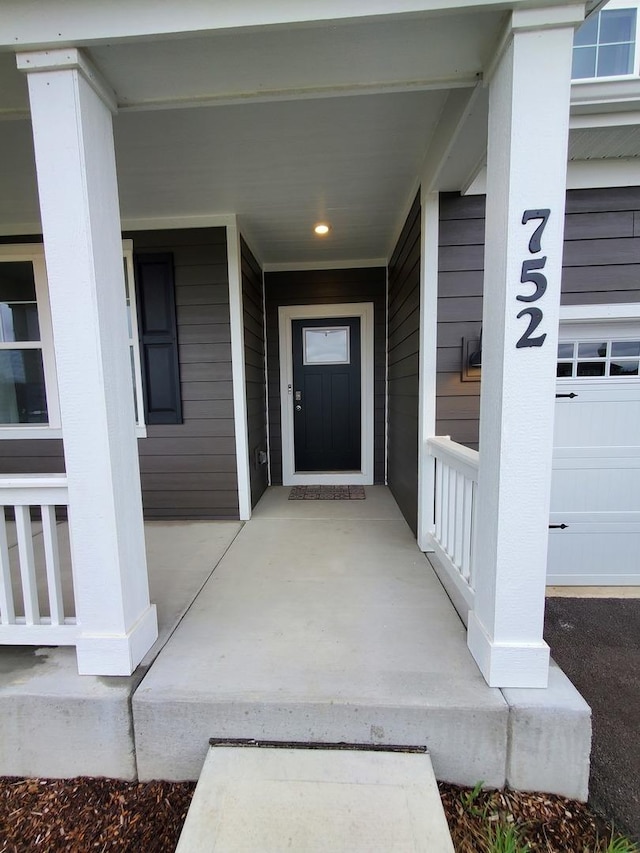 property entrance featuring covered porch