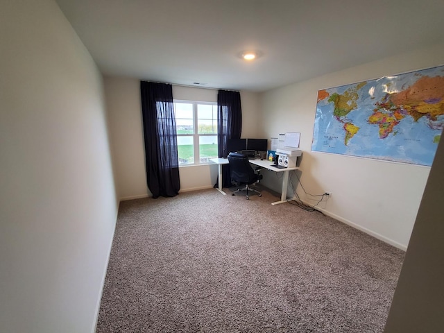 office featuring baseboards and carpet floors