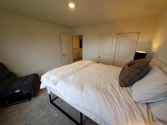 bedroom with a closet and carpet floors
