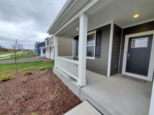 doorway to property with covered porch