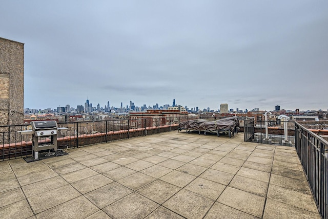 view of patio featuring a city view and grilling area