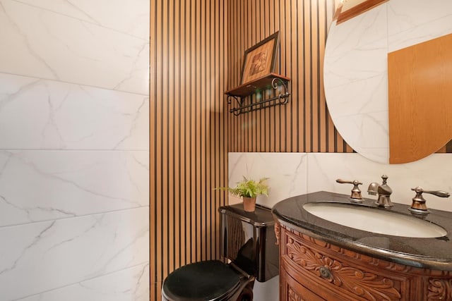 bathroom featuring toilet and vanity