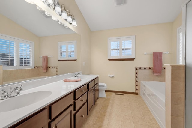 bathroom featuring plenty of natural light, visible vents, and a sink