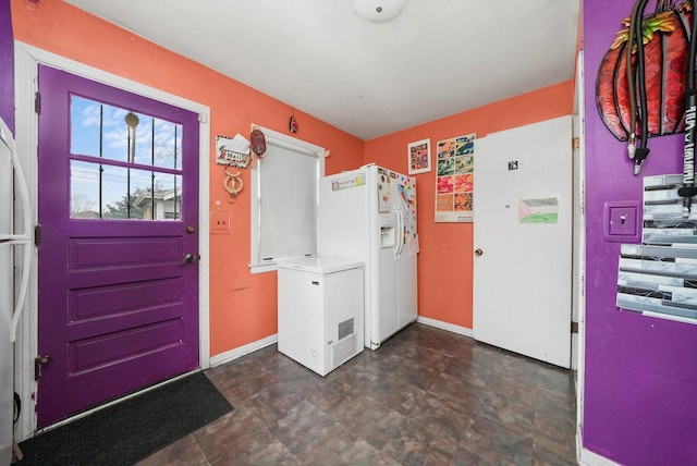 laundry room featuring baseboards