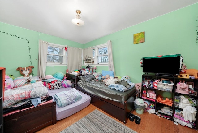 bedroom with light wood-style floors