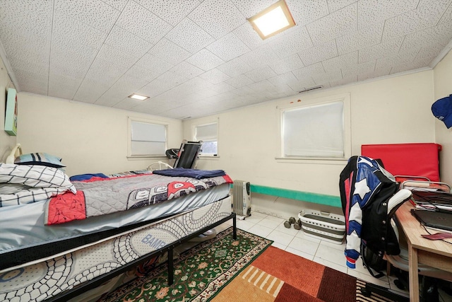 bedroom featuring light tile patterned floors